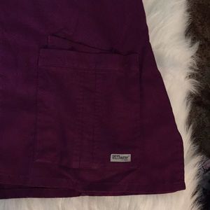 Grey's Anatomy Tops - Grey’s Anatomy Ladies Scrub Top in Purple Grey's Anatomy Tops - Grey’s Anatomy Ladies Scrub Top in Purple